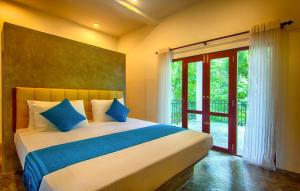 מיטה או מיטות בחדר ב-Wild Nest Villa Unawatuna
