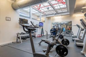 a gym with cardio equipment and tread machines at Loop 1BR w Gym Roofdeck nr Millennium Park CHI-249 in Chicago