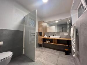 Koupelna v ubytování Villa Turnersee + 37 fotografií