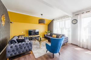 TV a/nebo společenská místnost v ubytování L'Adeline - Charmant appartement