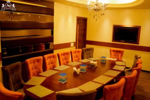 a dining room with a table and chairs at Hotel A9 Barnala in Barnāla +16 photos