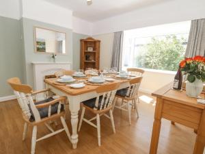 a dining room with a table and chairs at Awelfryn in Holyhead