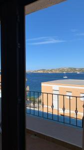 a view of the ocean from a balcony at Le Gemme di Mirto in Palau