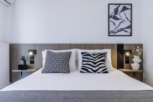 Giường trong phòng chung tại The Kokoon Volos Comfort Living