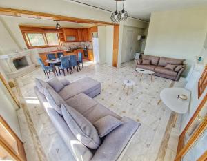 a living room with a couch and a table at Majestic View Resort in Nafpaktos