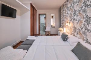 Afbeelding uit fotogalerij van Peregrina Pensión 5 in O Pedrouzo +22 foto's