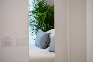 Postel nebo postele na pokoji v ubytování Be Your Home - Riviera Suites