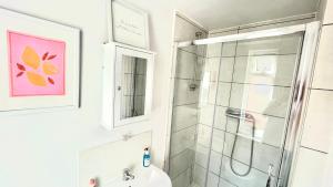 a bathroom with a shower and a sink at Northumberland Boutique Guest House #5 in Coventry +10 photos