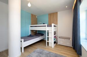 a small room with a bunk bed and a bunk bed at FeWo Prora - Gooddays in Binz