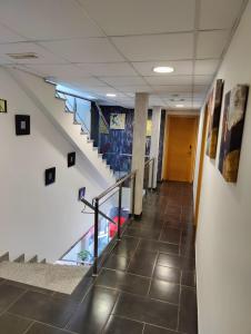 a hallway with stairs in a building at Hostal Manel in Pineda de Mar