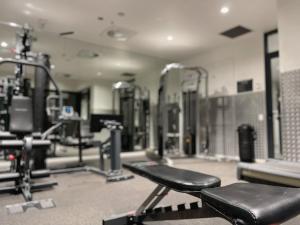 a gym with a black bench and some machines at Cultural Oasis Kingbed Apt at South Bank in Brisbane