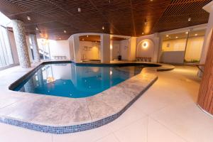 a large swimming pool in a hotel room at Aegean Resort Apartments in Gold Coast