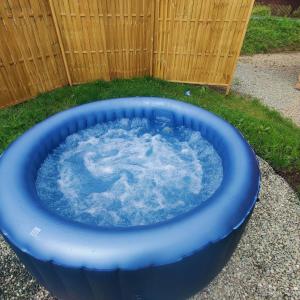a blue tub filled with water in a yard at Grojcówka in Żywiec