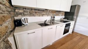 Kuchyň nebo kuchyňský kout v ubytování Ritter'S Rooms & Apartments