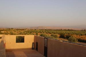 a building with a view of a field with a train at Magnifique villa à Marrakech in Marrakech