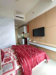 TV a/nebo společenská místnost v ubytování Collins Boulevard Serpong by SahabatMenginap