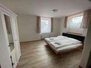 Postel nebo postele na pokoji v ubytování Apartmány Šumavánek