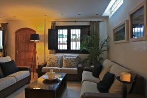 a living room with couches and a coffee table at Santuario San José in San José