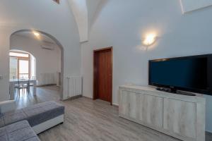 a living room with a large flat screen tv at Casa vacanze Petra in Squinzano