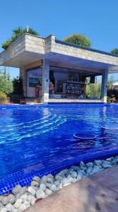 a swimming pool in front of a house at Wonderful Deluxe Appartement in Cascadas Family Resort in Sunny Beach