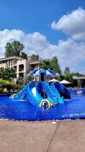 a water slide in the middle of a water park at Wonderful Deluxe Appartement in Cascadas Family Resort in Sunny Beach