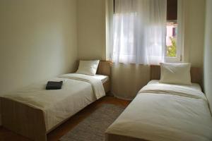 En eller flere senge i et værelse på Grosszügiges Apartment im Zentrum von Olten