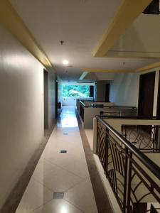 a hallway of a building with a balcony at Ruey's Homestay, Cinta Ayu, Pulai Spring in Skudai