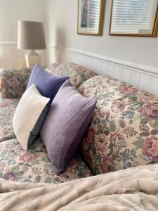 two pillows sitting on top of a bed at Banbridge Inn in Charlottetown