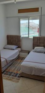 Ένα ή περισσότερα κρεβάτια σε δωμάτιο στο Appartement à louer