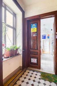 an entrance to a building with a wooden door at FRO-MEDIA - Streetside Room 2 - Community Space in Vienna