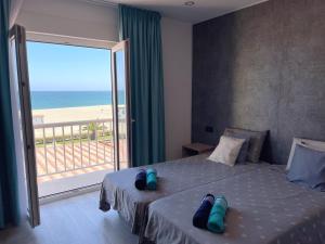 a bedroom with a bed with a view of the beach at Villa Dru in Roquetas de Mar