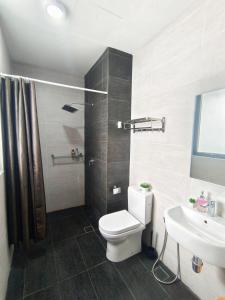 a bathroom with a toilet and a sink at One Bedroom Troika Kota Bharu by AGhome, Modern Design in Kota Bharu