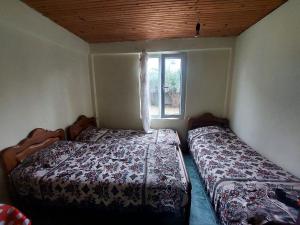 Postel nebo postele na pokoji v ubytování Guest house Bee