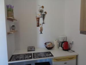 a kitchen with a stove and a counter top at La casetta in Roda