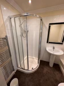 a bathroom with a shower and a sink at Reemdale Manor - Fulwood Row Preston PR25RW in Grimsargh