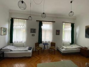 A bed or beds in a room at Kaleidoszkóp Ház Hostel