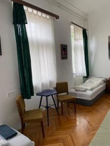 Postel nebo postele na pokoji v ubytování Kaleidoszkóp Ház Hostel
