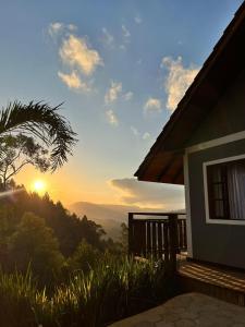 a view of the sunset from a house at Recanto das Cachoeiras in Angelina