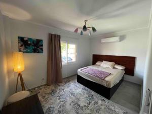 a bedroom with a bed and a lamp in it at Mountain View 1 /Ain El Sokhna in Ain Sokhna +110 photos