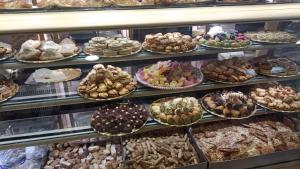 a display case filled with lots of different types of pastries at Le vie del centro in Sciacca