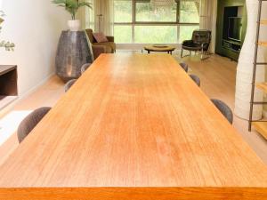a large wooden table in a living room at Lovely studio in Oud-Beijerland in Oud-Beijerland