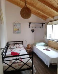 Postel nebo postele na pokoji v ubytování Casa Vacanza L'Ulivo