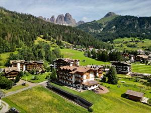 an aerial view of a resort in the mountains at Alpenhotel Panorama in Campitello di Fassa