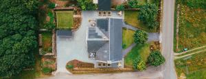 an overhead view of a house with a roof at Thomas Telford Lettings - Luxurious Interiors and Seaviews in Halistra