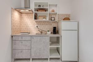 Kuchyň nebo kuchyňský kout v ubytování Ursa Apartment