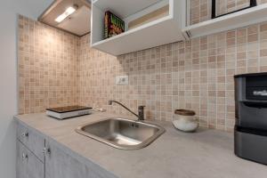 Kuchyň nebo kuchyňský kout v ubytování Ursa Apartment + 11 fotografií