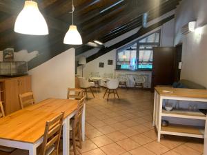 a dining room with a table and chairs in it at Cascina Bellaria in Milan +68 photos