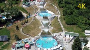 an aerial view of a water park with two pools at Apartmani Sarah 4 Tuzla in Tuzla