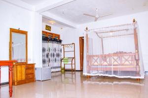 a living room with a window and a dresser at Blowhole Unawatuna in Unawatuna +96 photos