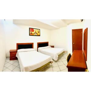 Postel nebo postele na pokoji v ubytování Hotel en Guadalajara Posada Mi Rey